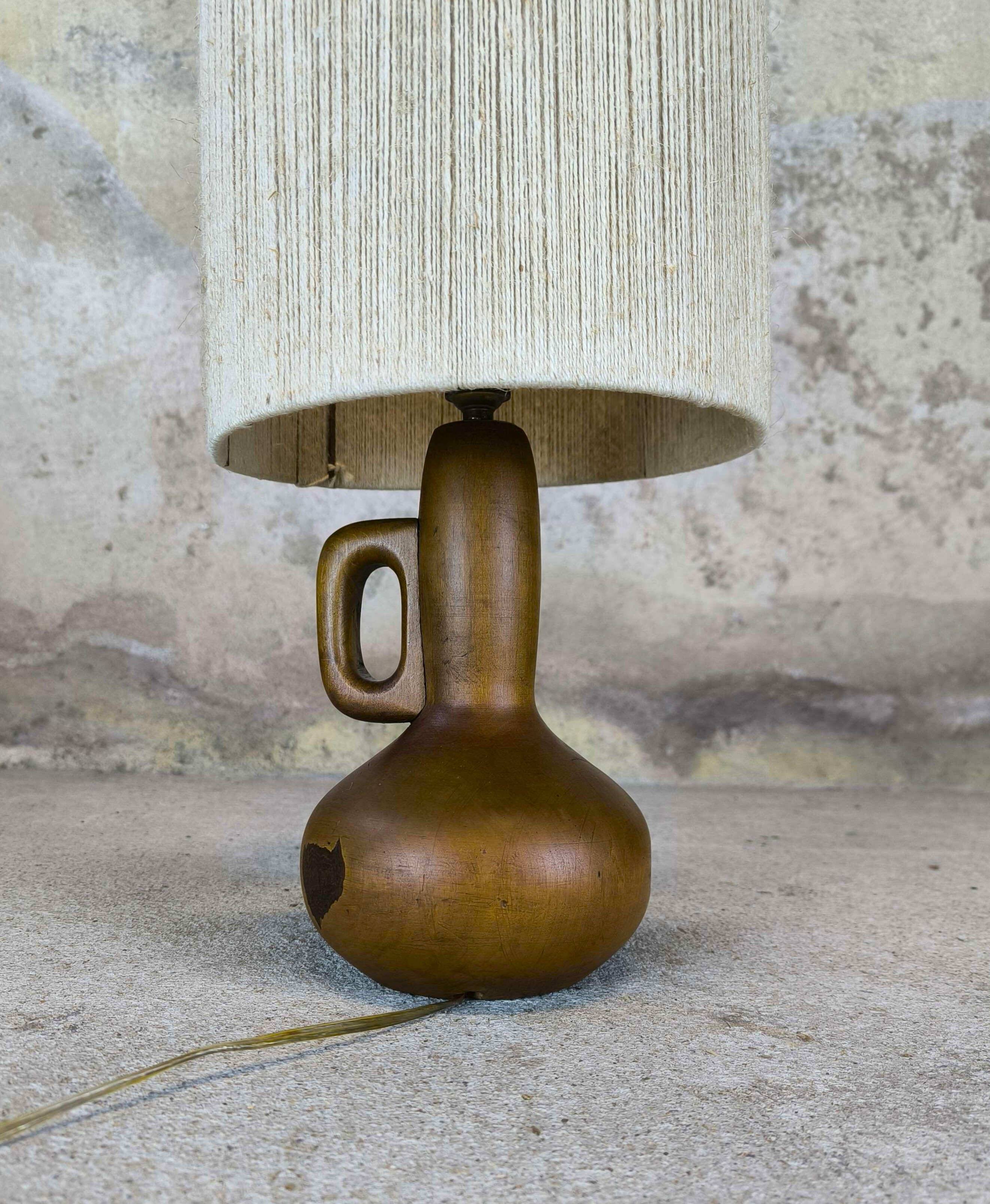 Vintage wooden table lamp with a wool shade.