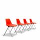 Set of 4 orange chairs designed by Robin Day for Hille.