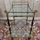 Glass, brass, and wood side table from the 1950s/60s.