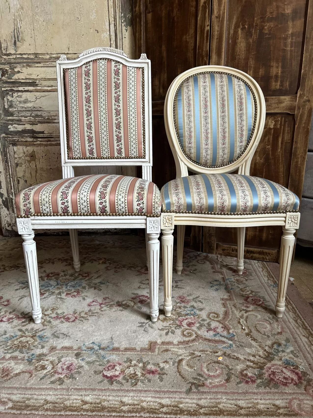 Pair of Louis XVI style chairs in painted wood and satin, classic elegance.