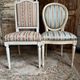 Pair of Louis XVI style chairs in painted wood and satin, classic elegance.