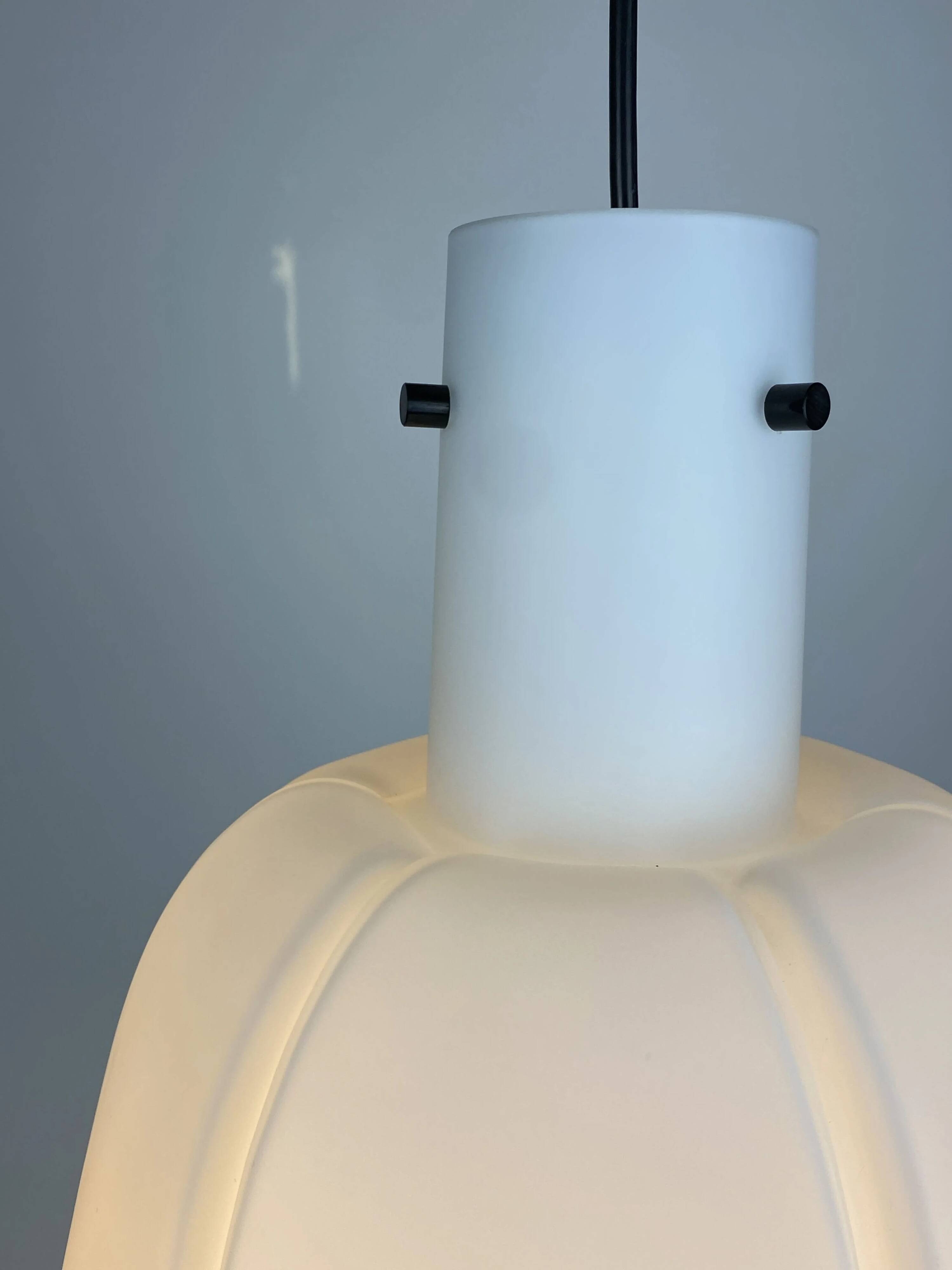 Frosted glass pendant in the shape of a white flower by Glashütte Limburg.