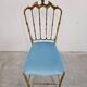 Mid-century Chiavari accent chair in solid brass with a plush seat.