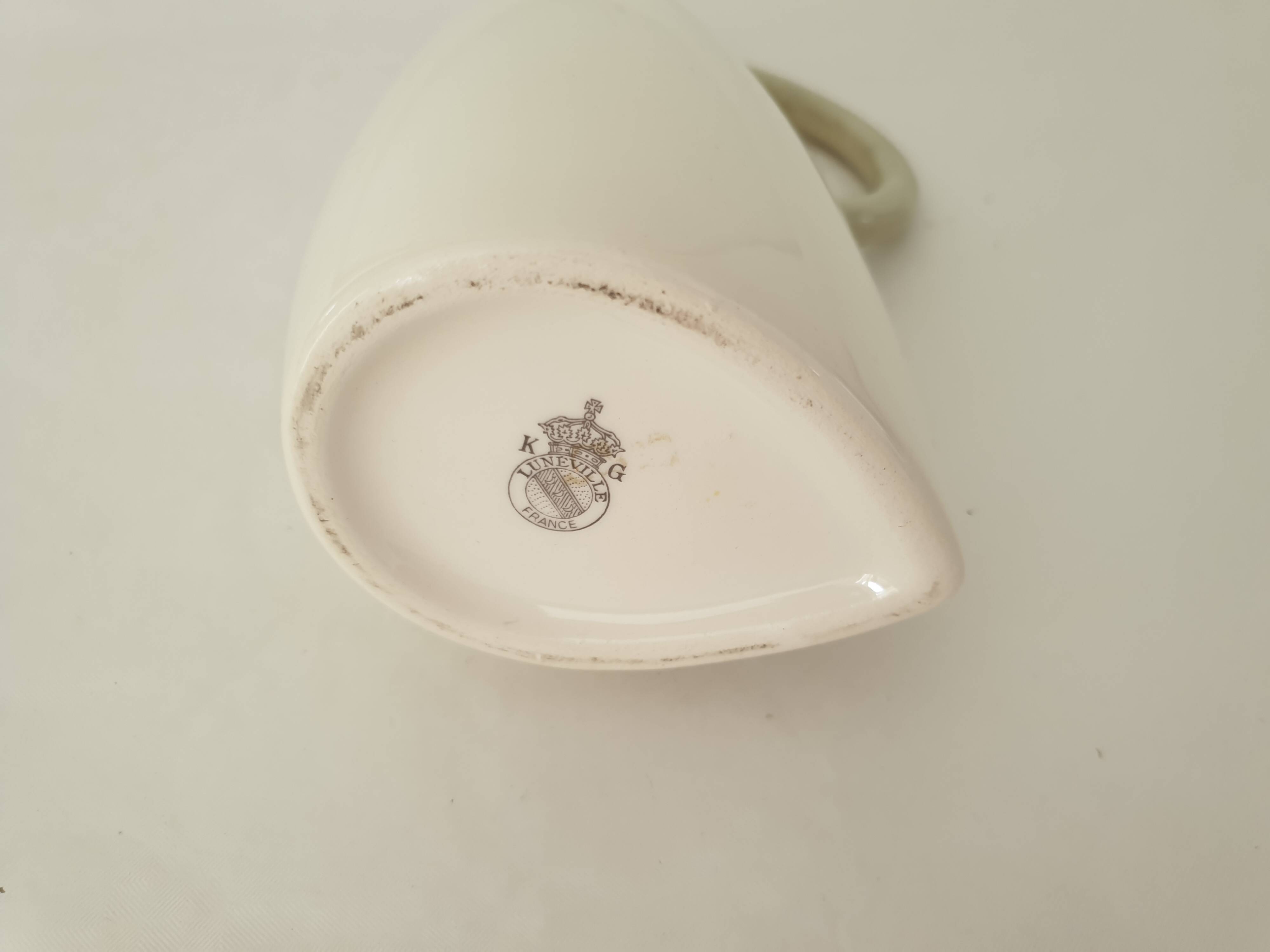 White earthenware pitcher signed KG Lunéville