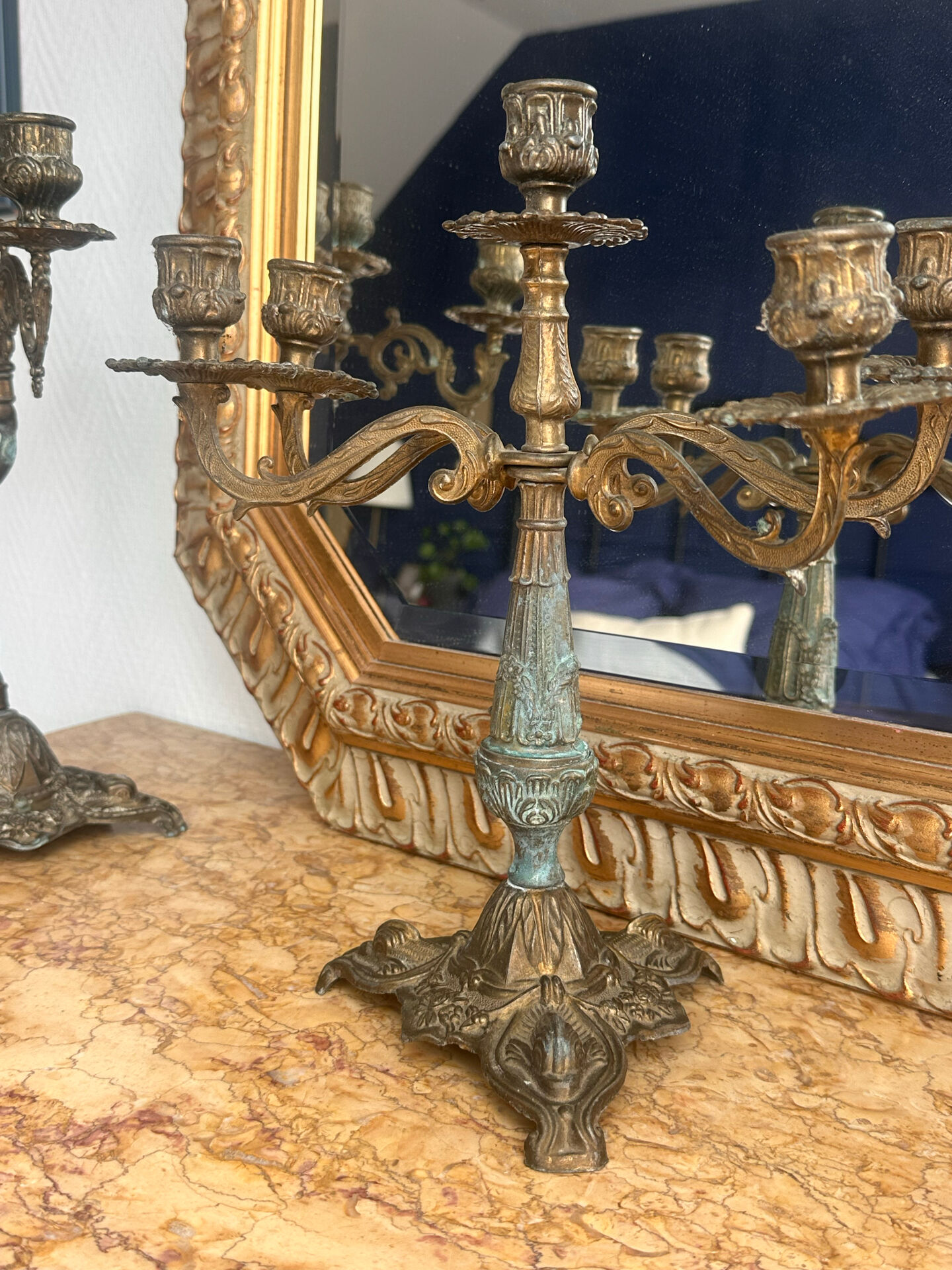 Set of 3 antique three-branch candelabras with cherubs and bronze patina.