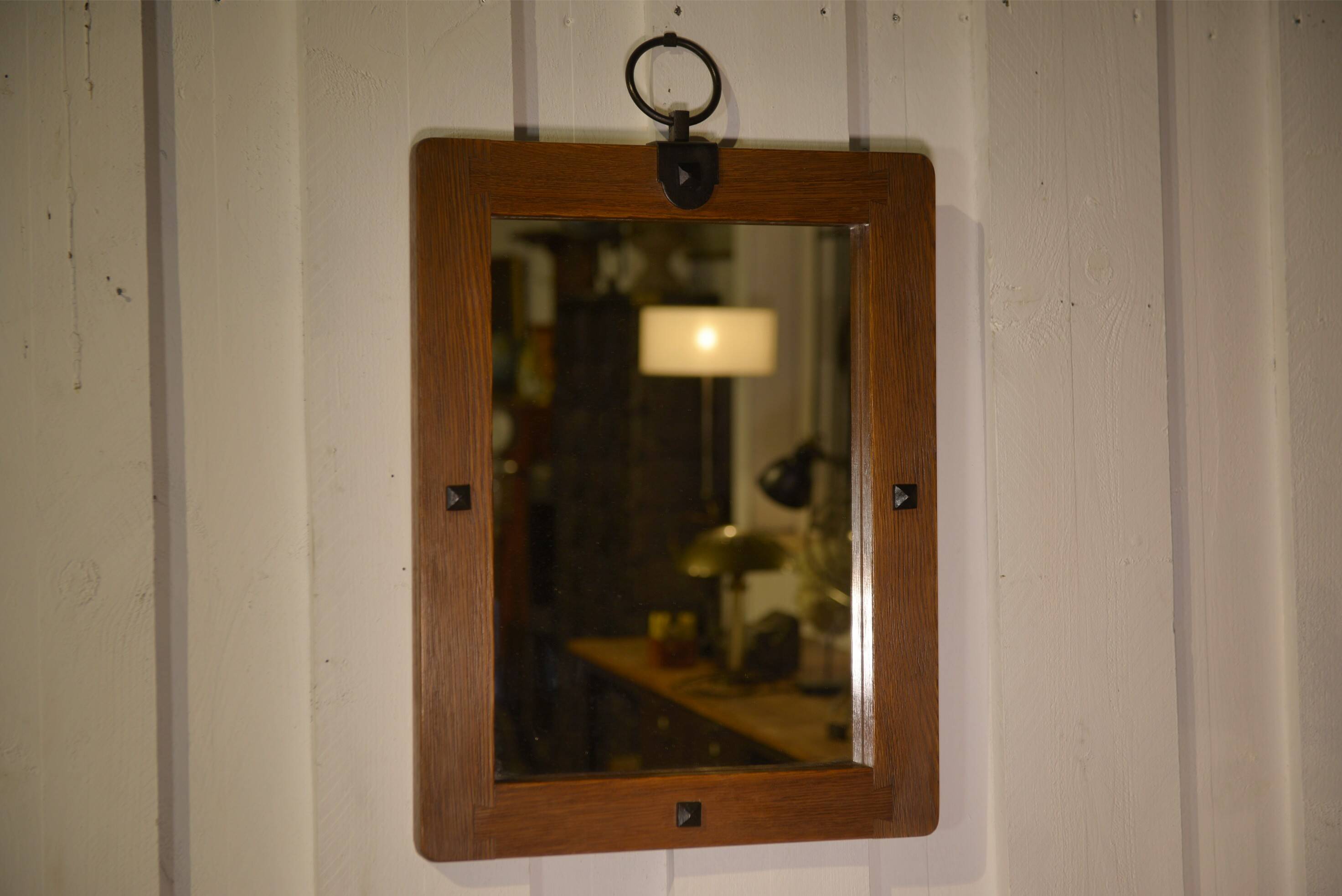 Brutalist mirror in solid oak with metal ring, 1960s.