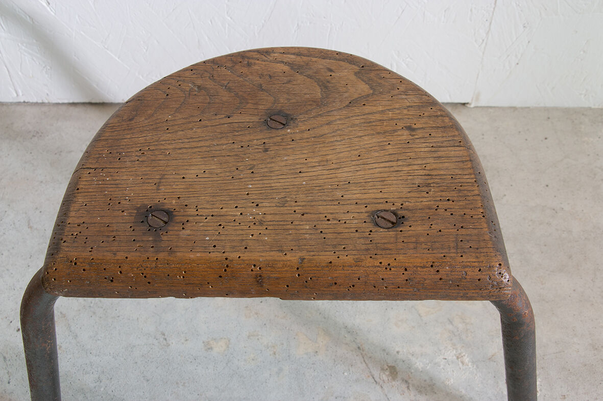 Wooden and tripod metal stool