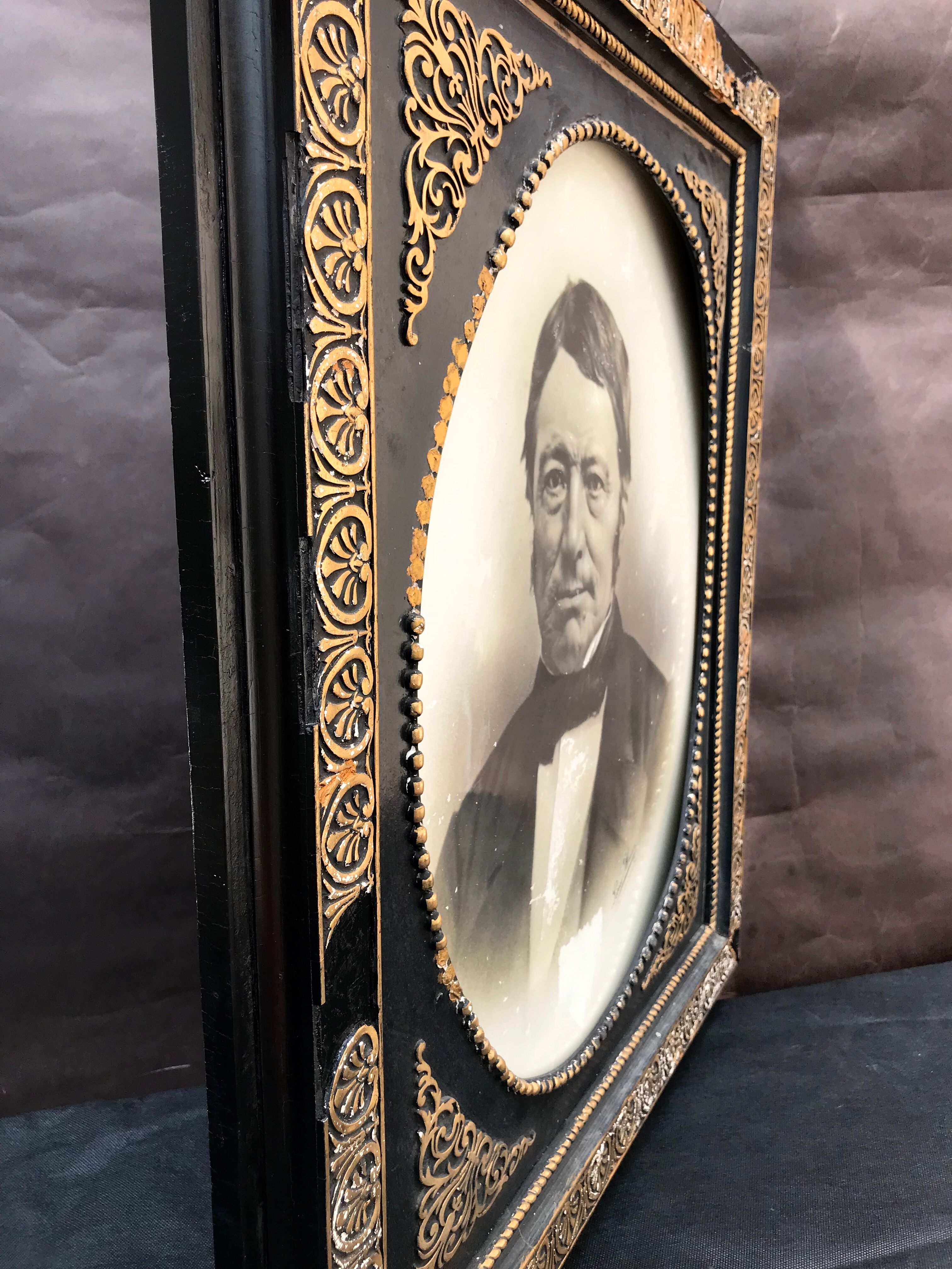 Black and gilded ebonite frame, wood and plaster 19th century