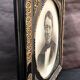Black and gilded ebonite frame, wood and plaster 19th century