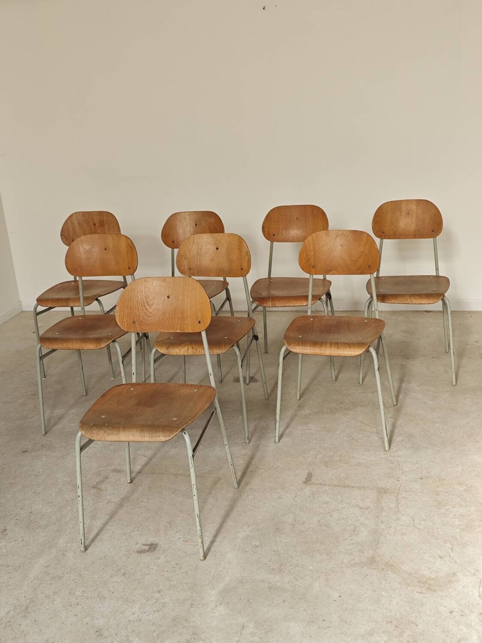 Set of 8 metal and wood school chairs  
Ex Czechoslovakia 1960