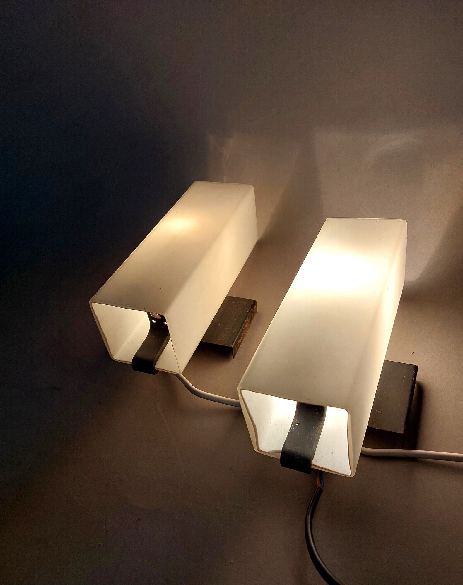 Pair of modernist sconces in black metal and white opaline vintage