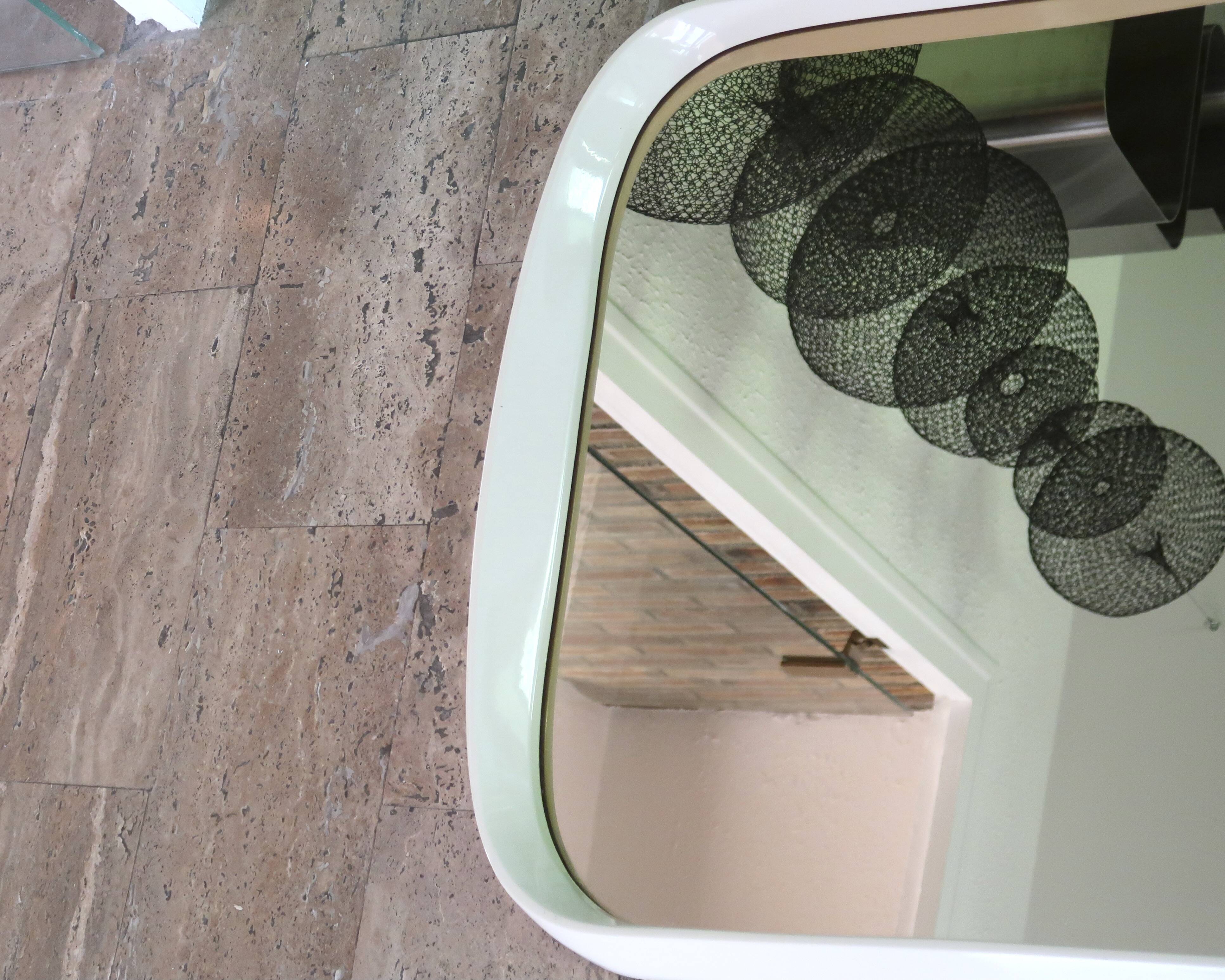 Rectangular mirror, horizontal or vertical, in white lacquered wood, 1970s.