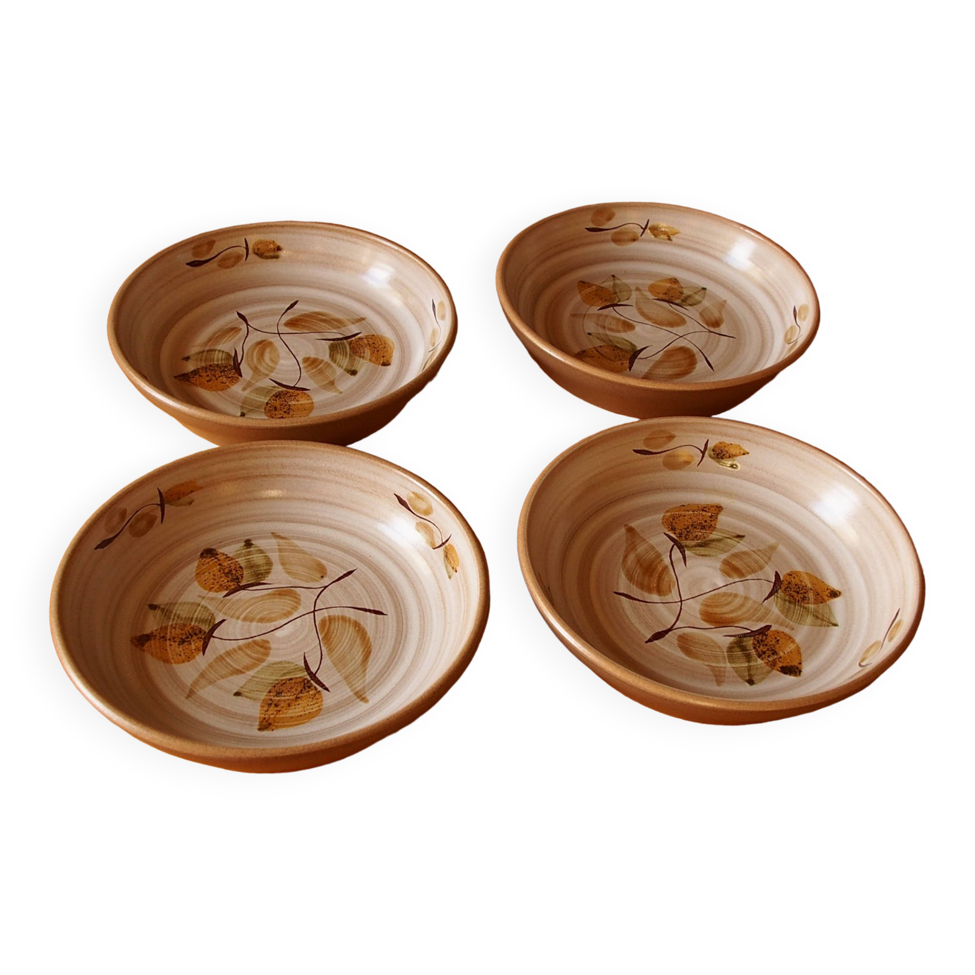 Four bowl-shaped plates in vintage Niderviller stoneware with plant decoration