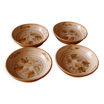 Four bowl-shaped plates in vintage Niderviller stoneware with plant decoration