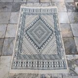 White and blue handwoven rug in natural wool