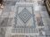 White and blue handwoven rug in natural wool