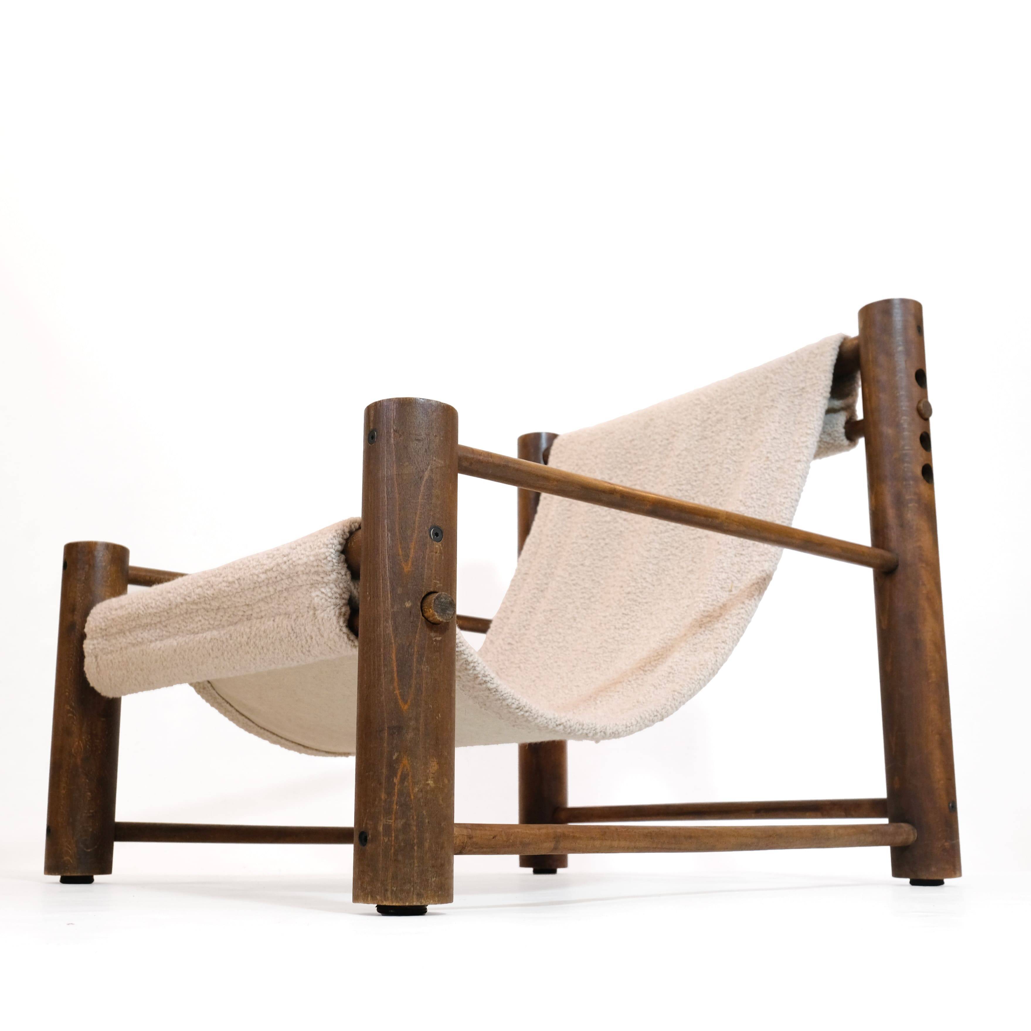 Solid wood armchair with adjustable backrest.