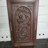 Ancienne porte en bois sculpté en chêne