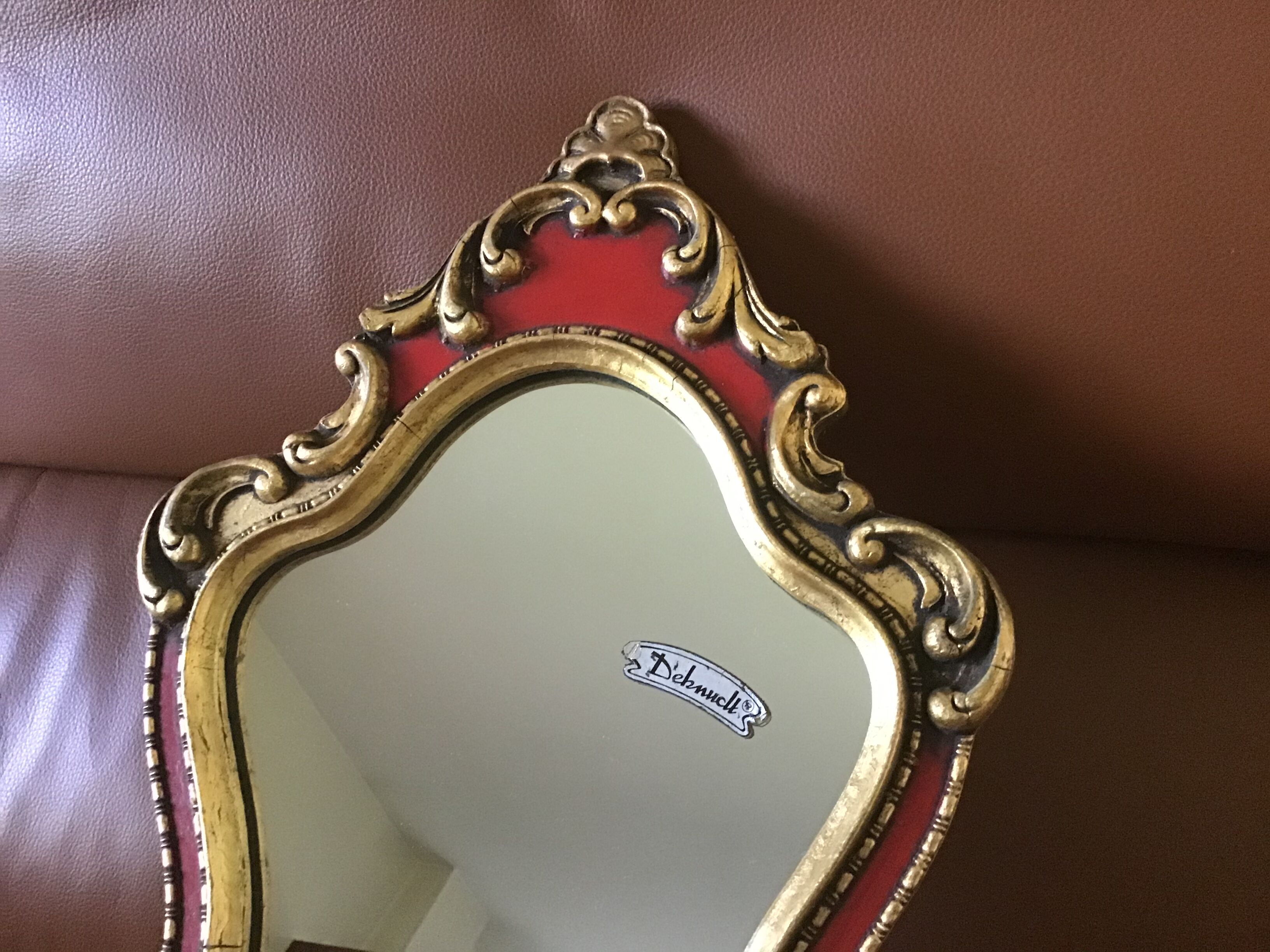 Gold and red mirror brand Deknudt
