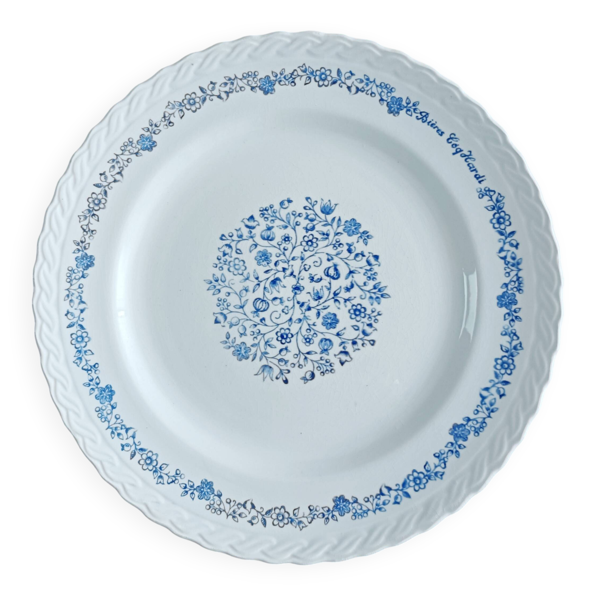 Round antique earthenware dish with floral decoration