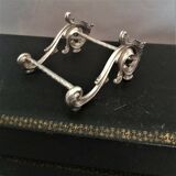 Twelve knife holders with ladle doors.