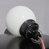 Trio of opal glass and bakelite globe pendant lights