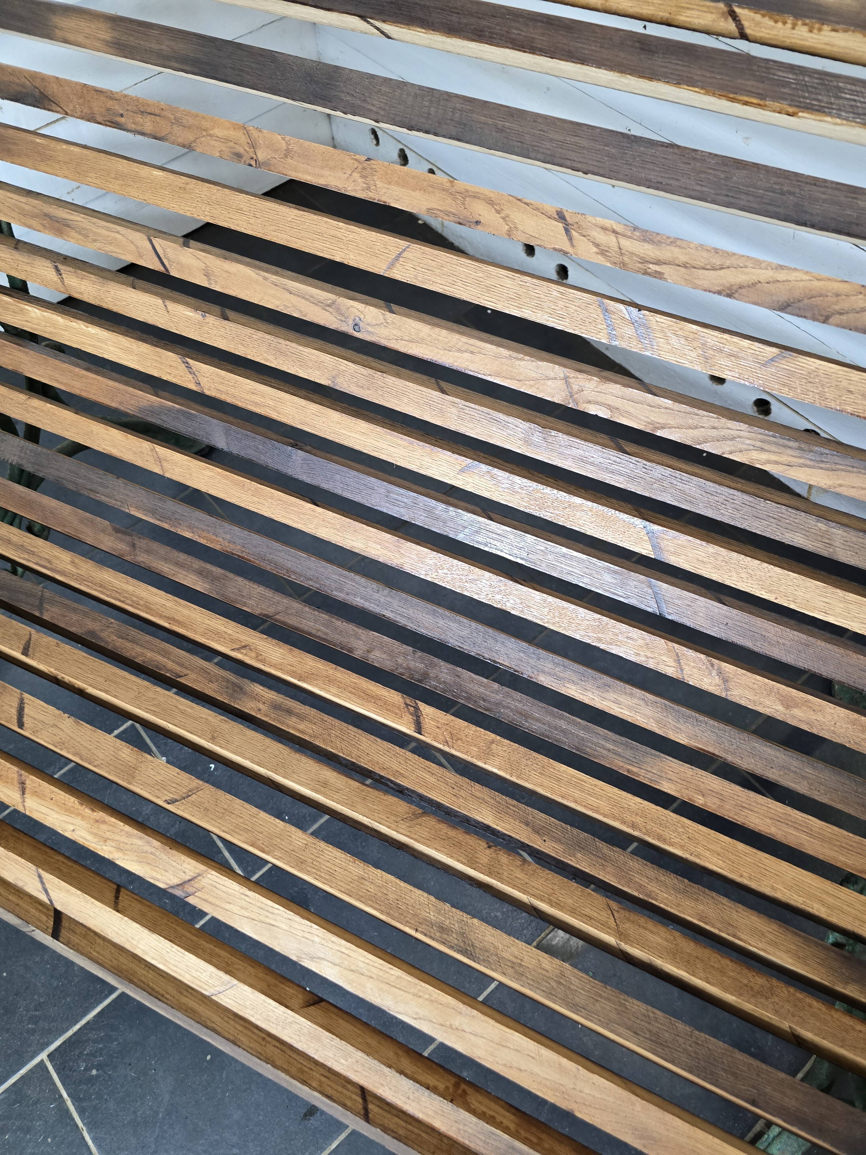 Old cast iron garden bench with oak slats