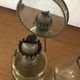 Oil lamp with glass pedestal and integrated round mirror