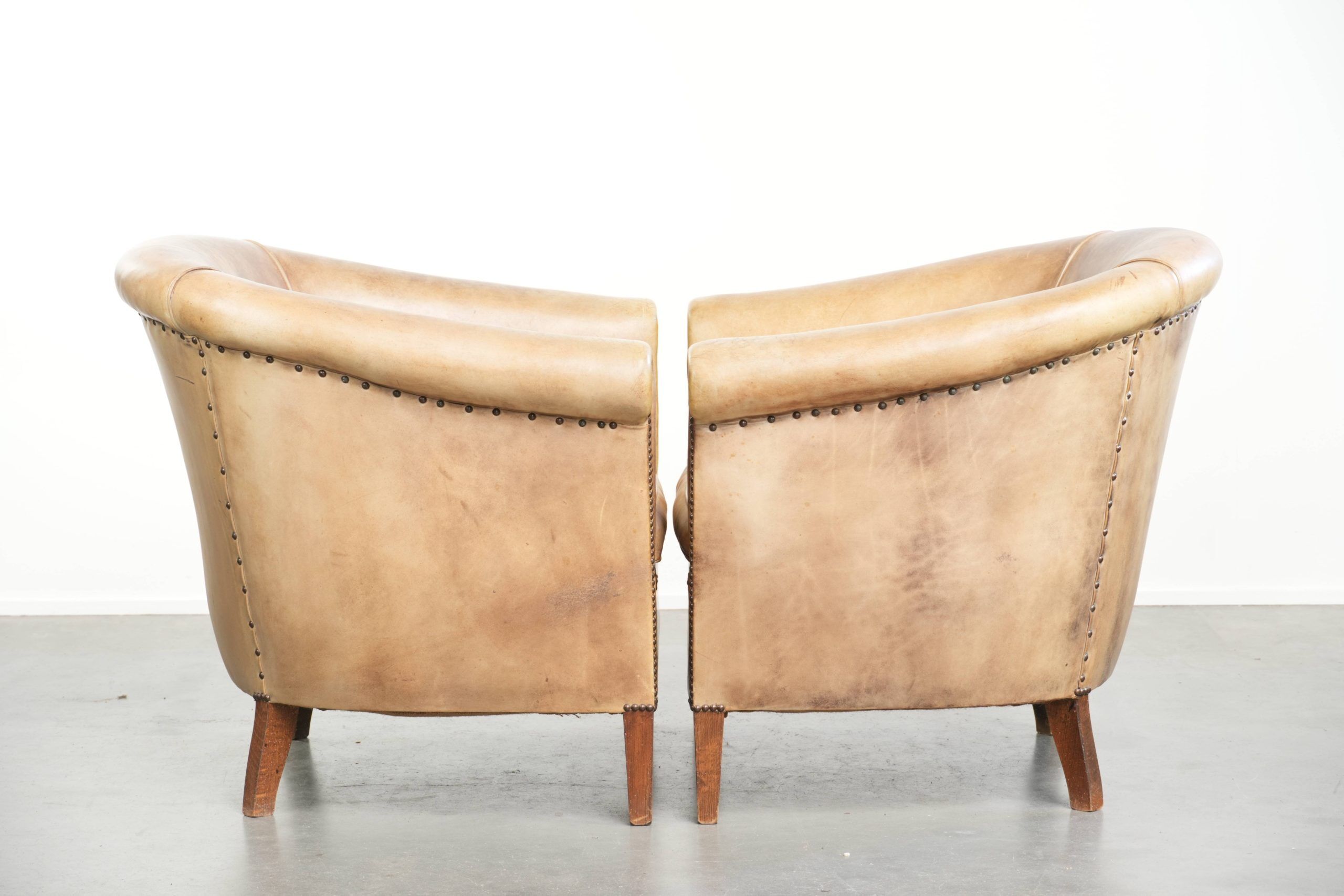 Set of two vintage cowhide club armchairs in English style