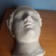 Antique plaster face of a woman