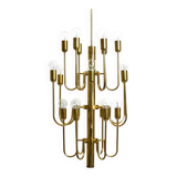 Three staged 18 arm Mid Century brass chandelier with a long brass rod