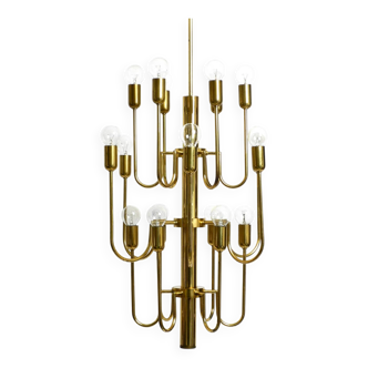 Three staged 18 arm Mid Century brass chandelier with a long brass rod