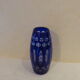 Blue and transparent glass vase, has vintage geometry patterns