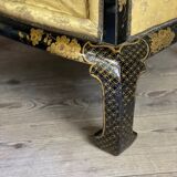 A set of two armchairs, a sofa and two poufs in lacquered wood with gilded chinoiserie decoration.