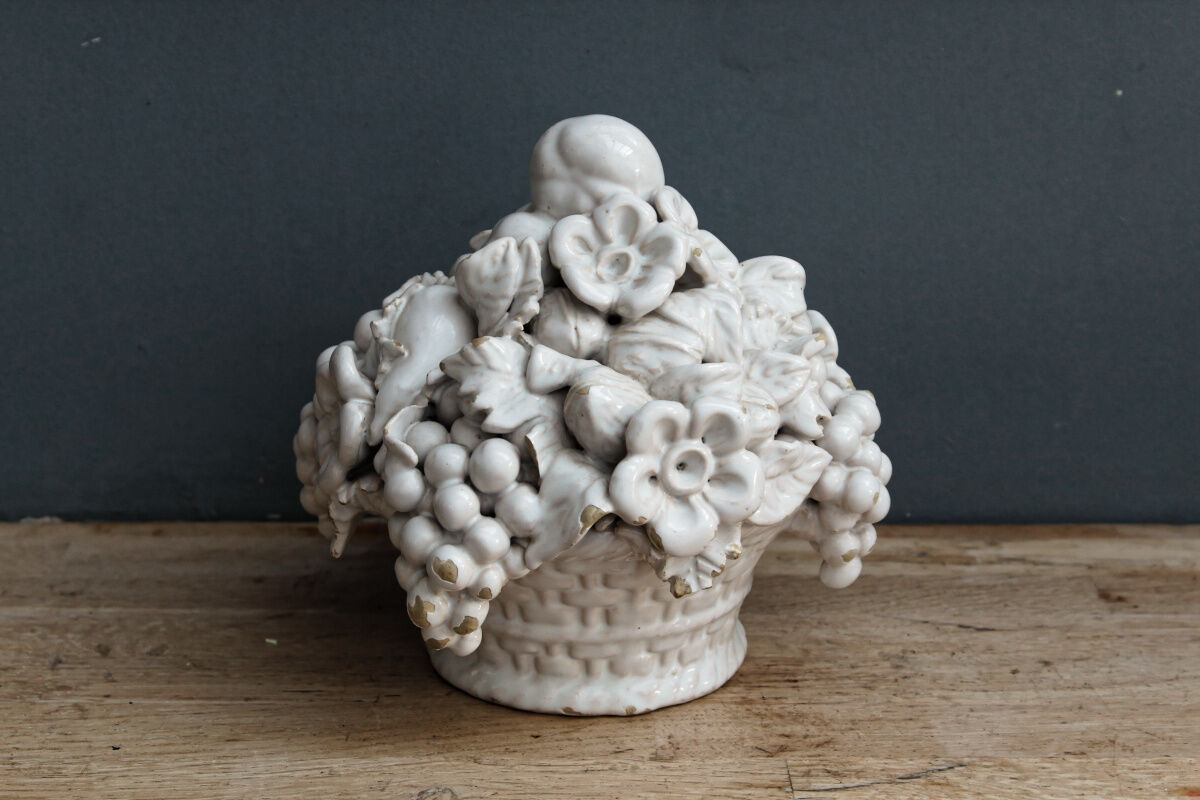 Ornamental basket decorated with trompe l'oeil fruits