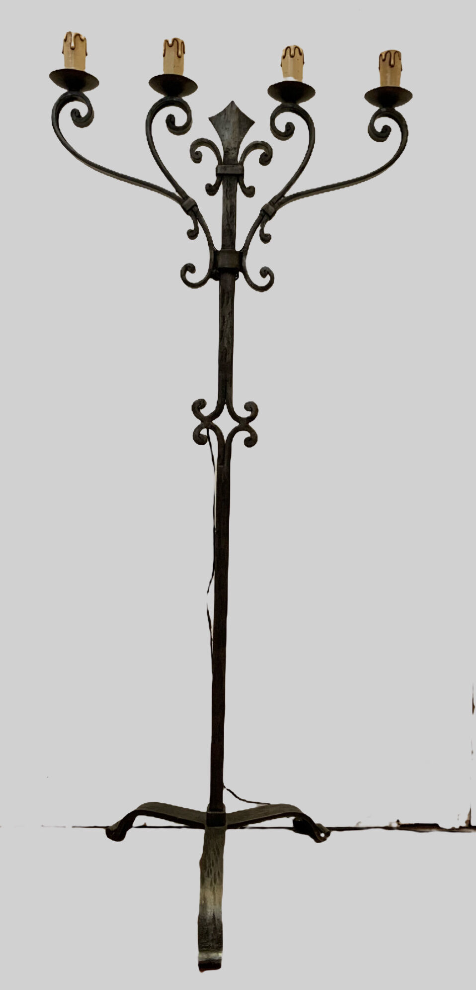 Floor lamp has four wrought iron lights