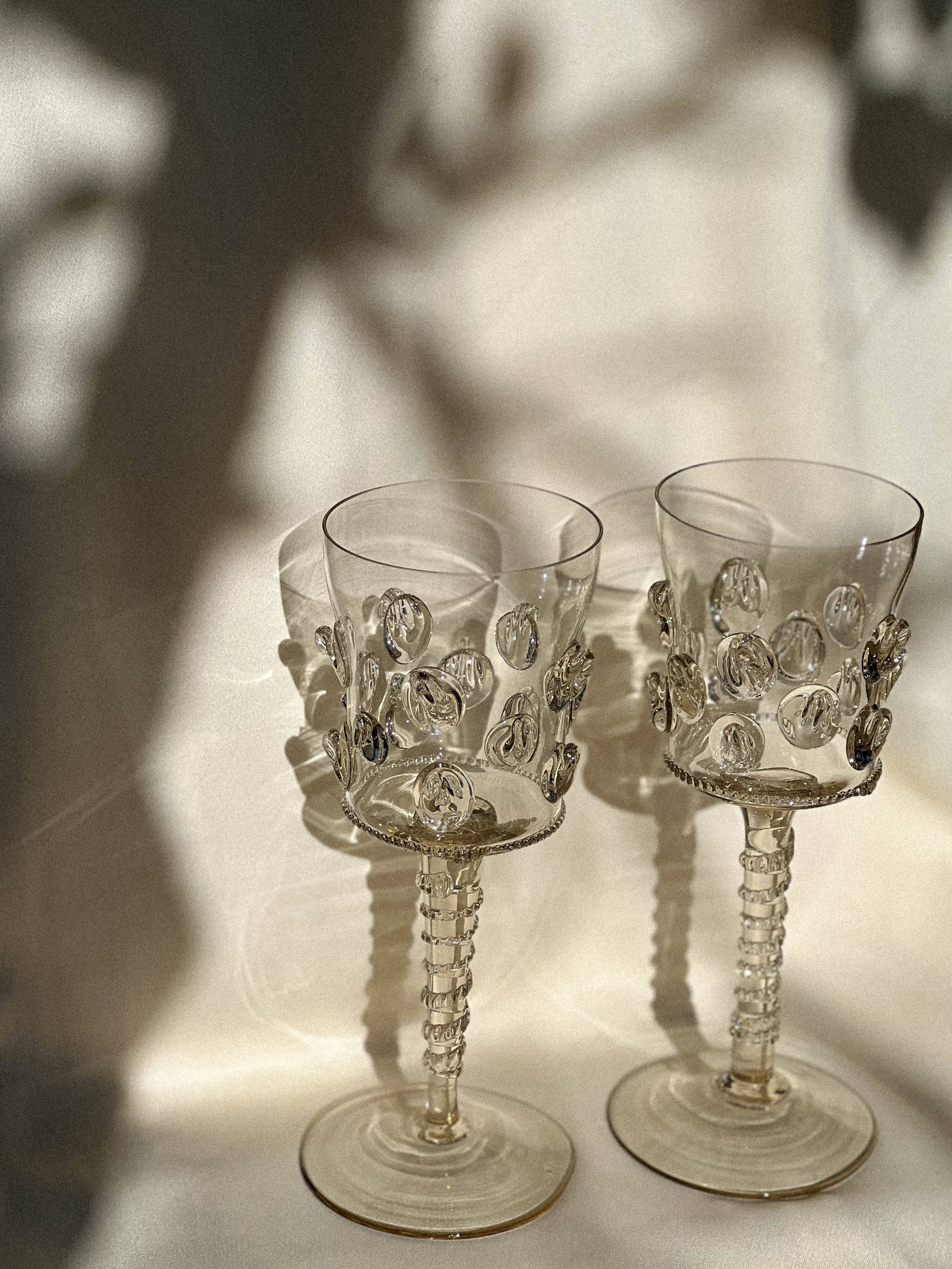 pair of blown wine glasses - green