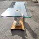 Italian coffee table with glass top, wooden base, and porcelain legs