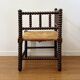 Turned wood corner chair with straw seat