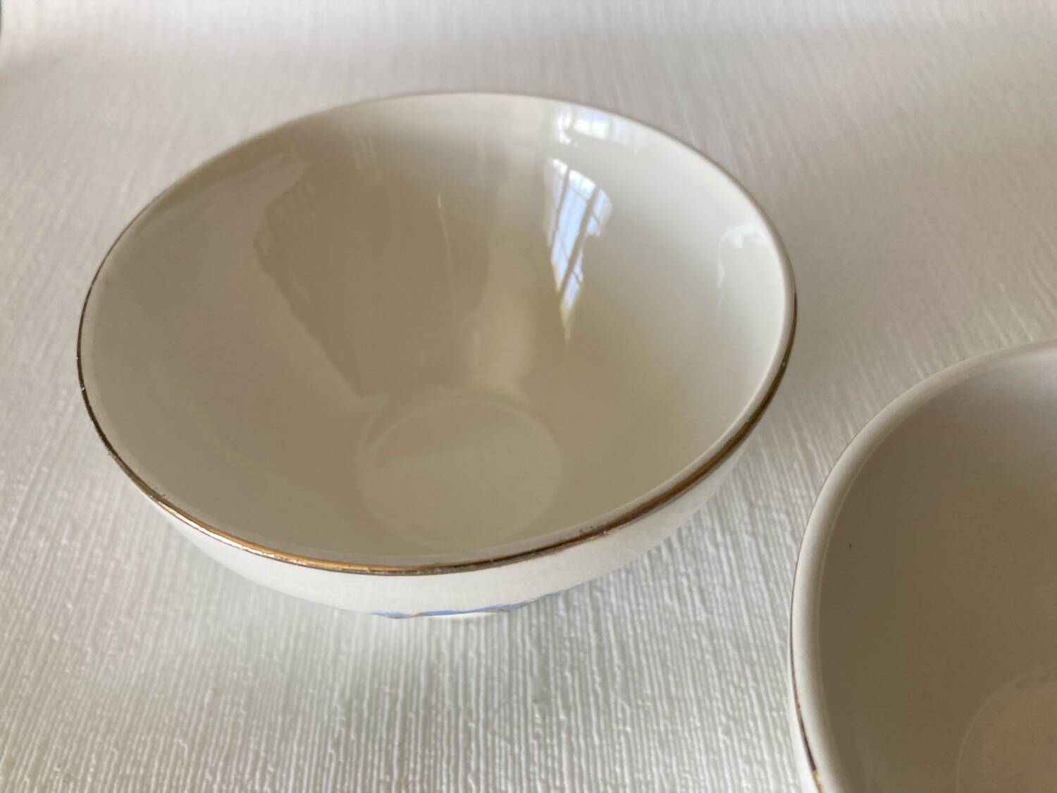 Pair of small faceted bowls with cow illustrations from the 40s and 50s