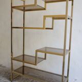 Bookcase or shelf in brass and smoked glass from the 70s