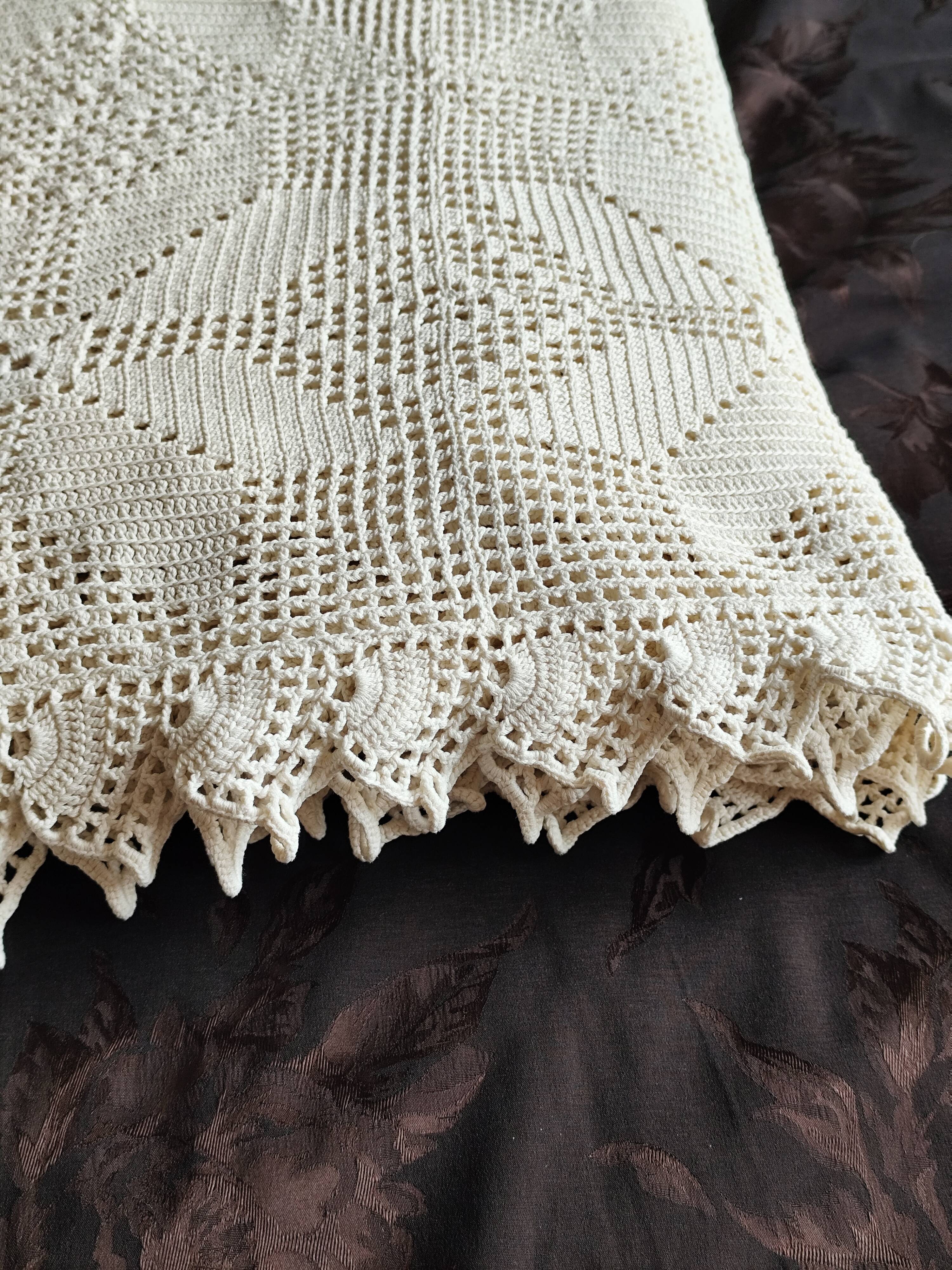 White cotton bedspread, crocheted sofa throw with star patterns