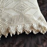 White cotton bedspread, crocheted sofa throw with star patterns