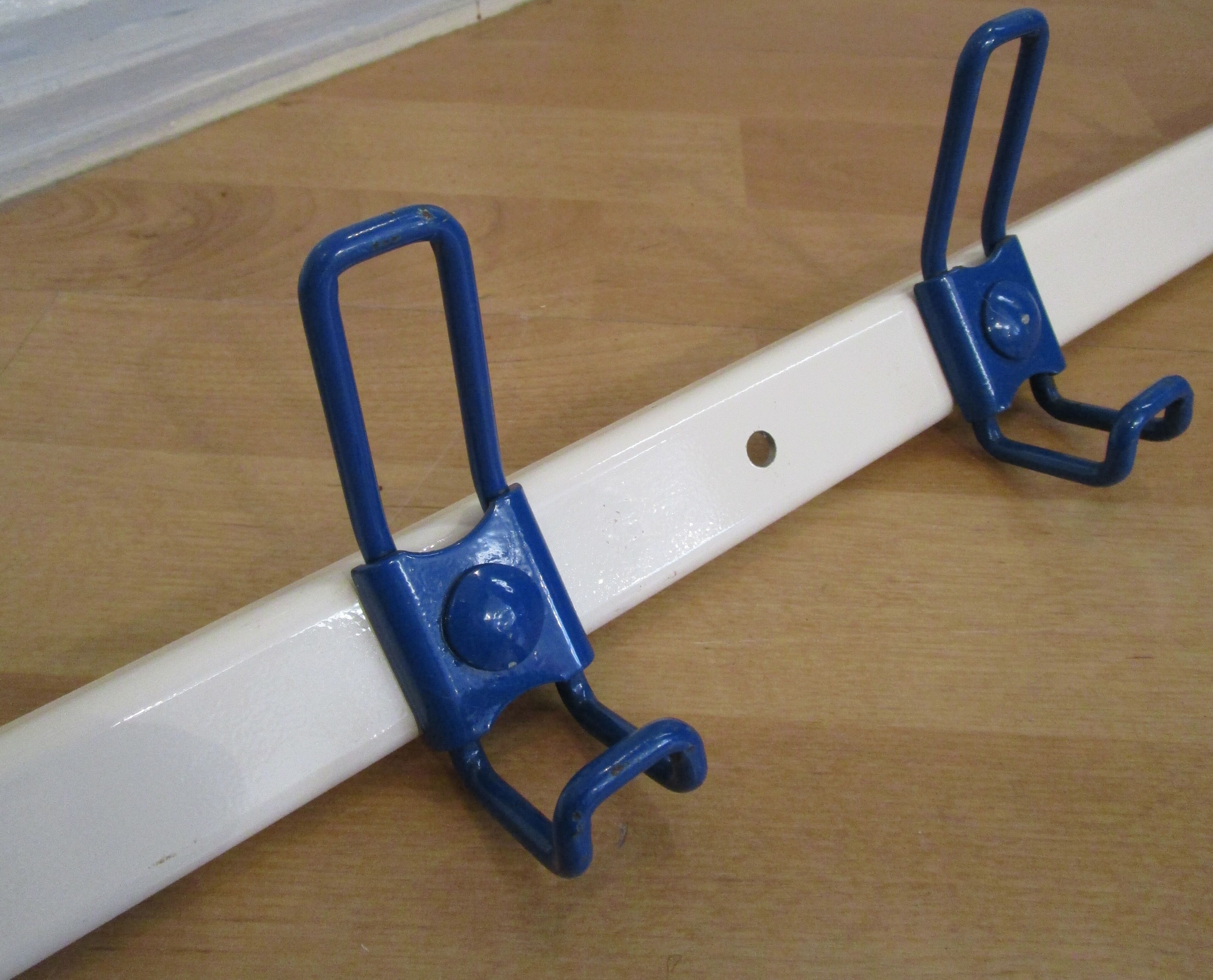 White and blue lacquered steel wall coat holder