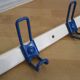 White and blue lacquered steel wall coat holder