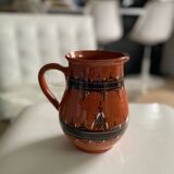 Terracotta ceramic carafe with geometric and white patterns