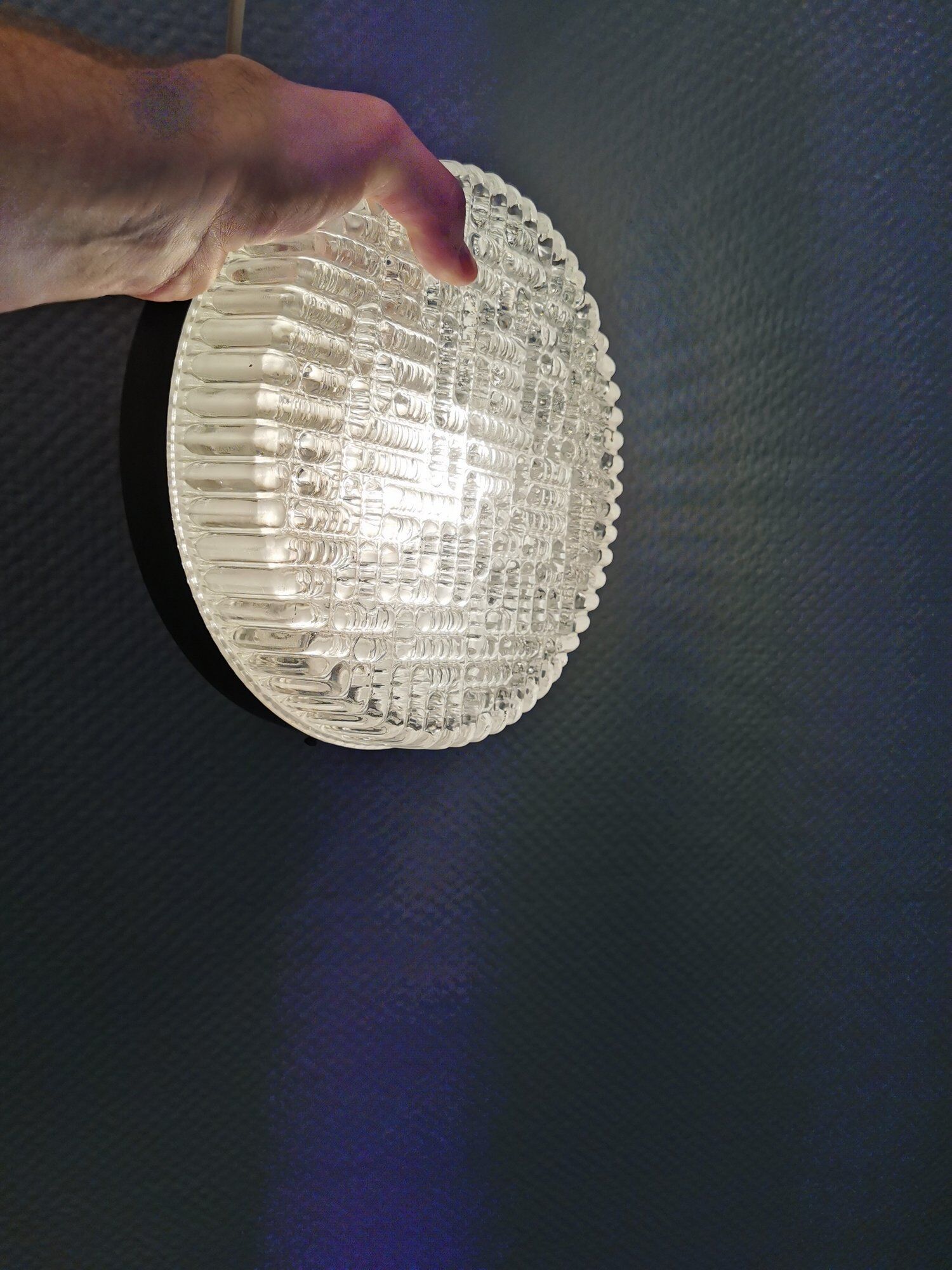 Ceiling light, in dark metallic paint with thick glass shade with beautiful details in the glass.