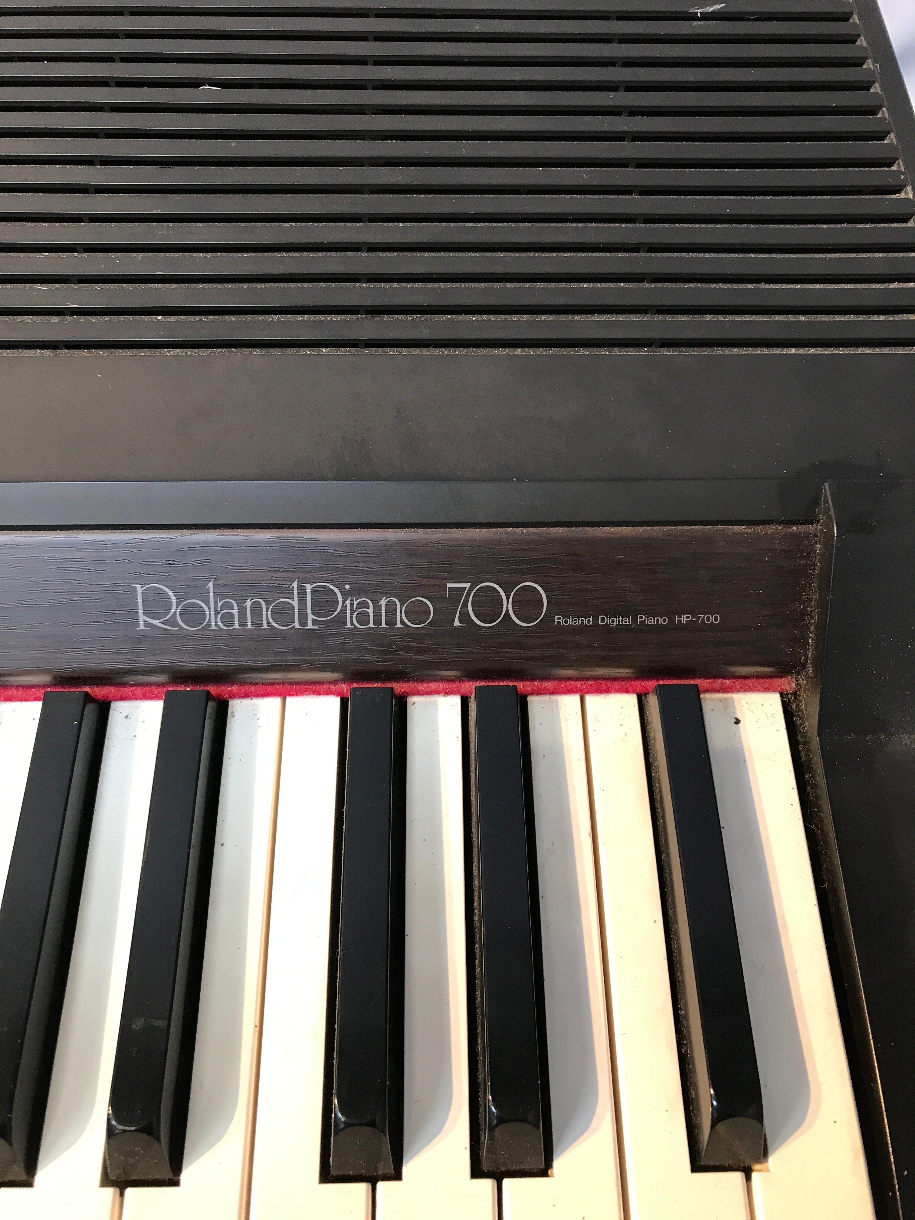 Roland HP 700 keyboard and its stand with pedal