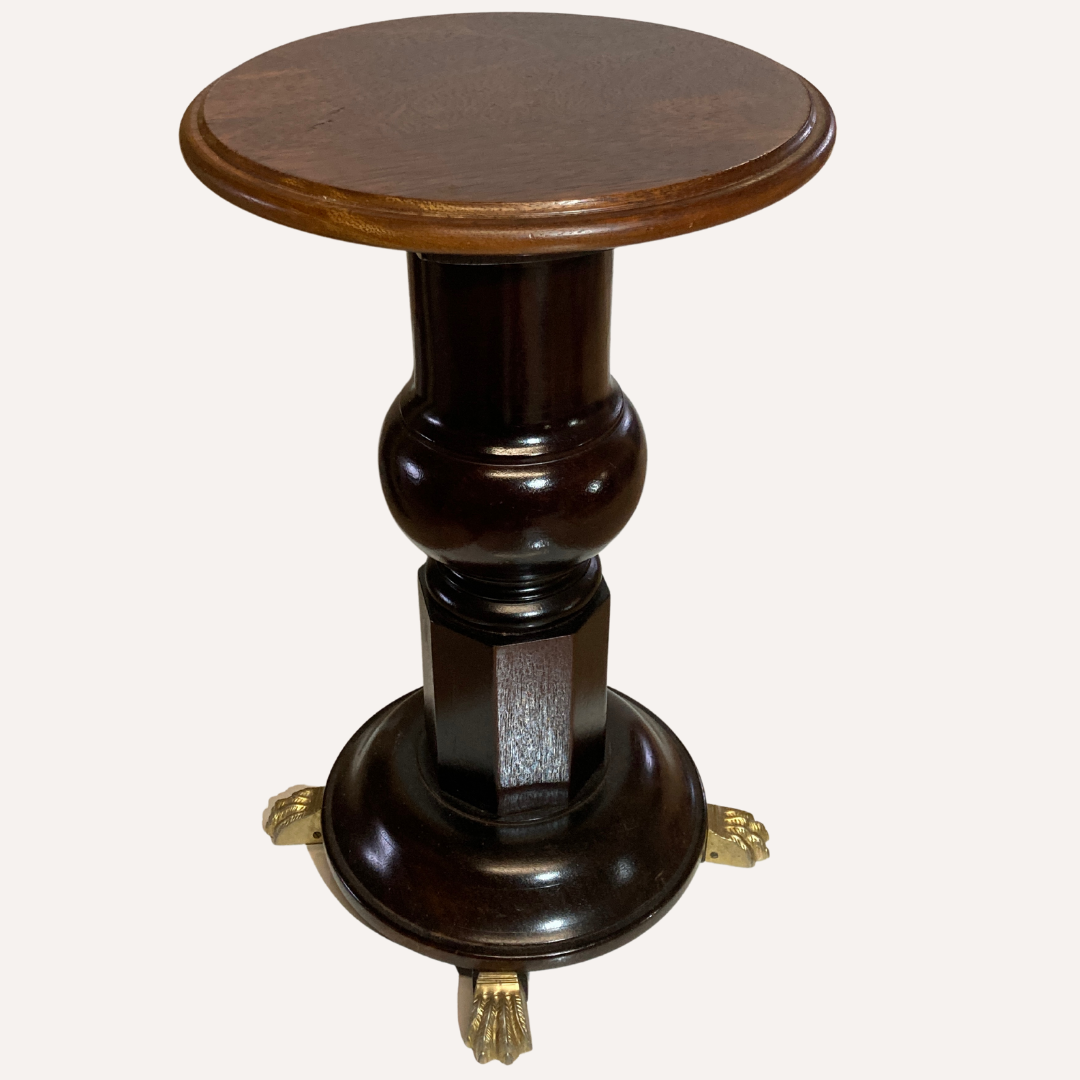 Vintage mahogany pedestal or side table with brass claw feet