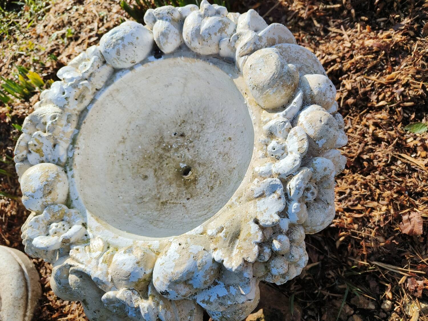 Pair of round stone fruit bowls on foot